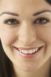 Studio Portrait Of Smiling Woman