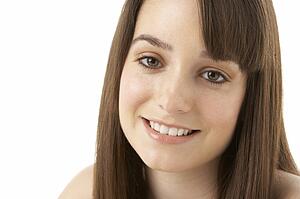 Studio Portrait Of Teenage Girl On White Background