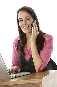 Female Businesswoman Using Laptop At Desk