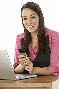 Female Businesswoman Using Laptop At Desk