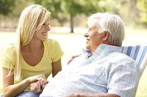 Senior Man Talking To Adult Daughter