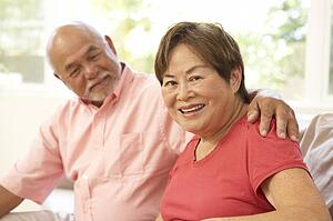 Senior Couple Relaxing At Home Together