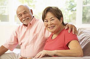Senior Couple Relaxing At Home Together
