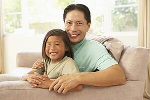 Father And Son Relaxing At Home