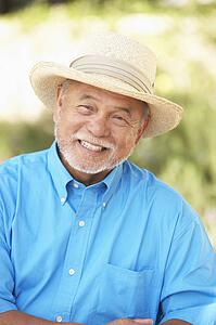 Senior Man Relaxing In Garden