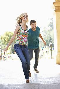 Young Couple Visiting Building In City