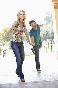 Young Couple Visiting Building In City