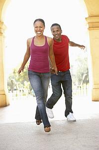Young Couple Visiting Building In City
