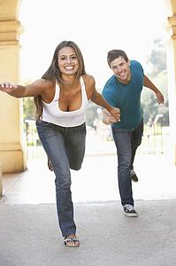 Young Couple Visiting Building In City