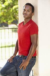 Young Man Leaning Against Pillar