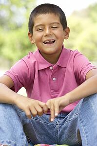 Portrait Of Young Boy In Park
