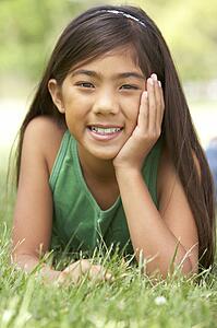 Portrait Of Young Girl In Park