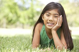 Portrait Of Young Girl In Park