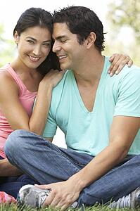 Portrait Of Young Couple In Park