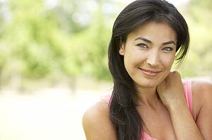 Portrait Of Young Woman In Park