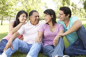 Grandparents With Adult Children In Park