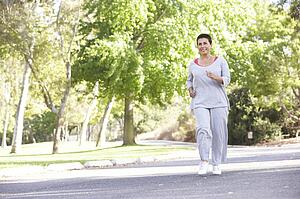 Senior Woman Jogging In Park