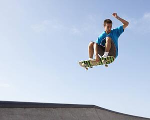Teenage Boy In Skateboard Park