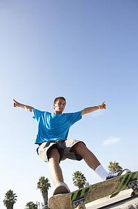 Teenage Boy In Skateboard Park
