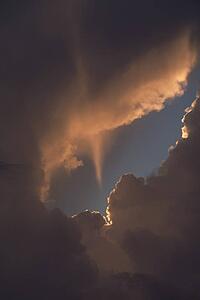 Sun beam passes through clouds