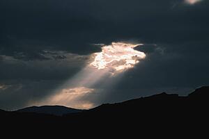 Sunlight breaking through heavy clouds