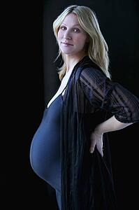 Pregnant woman in black leotard