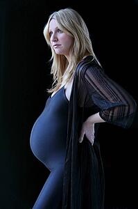 Pregnant woman in black leotard