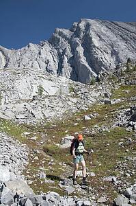 Female hiker on rocky trail, Kananaskis Country, Alberta, Canada