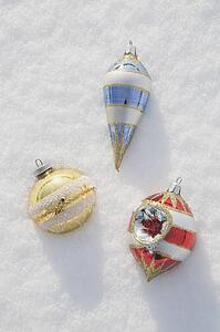 Christmas ornaments in snow