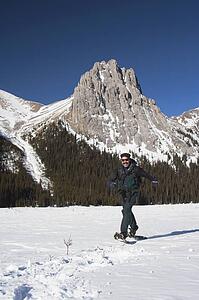 Man in snowshoes in the mountains