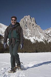 Man walking in snowshoes in the mountains