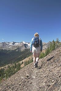 Woman hiking on a mountain trail