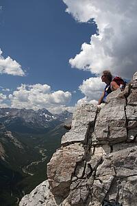 Man sitting on a mountain top enjoying the view