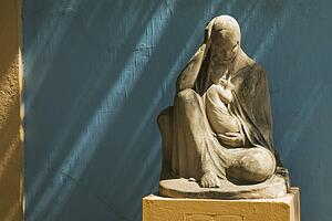 stone statue of the virgin mary holding jesus, buenos aires, argentina