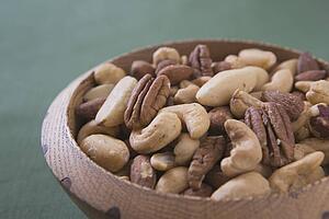 mixed nuts in a wooden bowl