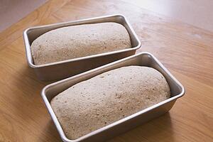 two unbaked loaves of bread