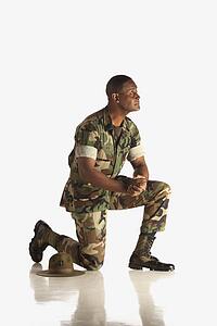 fort lauderdale, florida, united states of america; a military man down on one knee