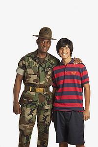 fort lauderdale, florida, united states of america; a military man with his arm around a teenage boy