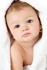 Studio Portrait Of Baby Boy Wrapped In Towel