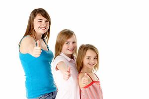 Three Girls Giving Thumbs Up Gesture In Studio