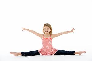Young Girl In Gymnastic Pose Doing Splits