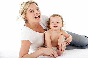 Studio Portrait Of Mother With Young Baby Boy