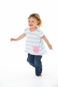 Young Girl Running In WhiteStudio