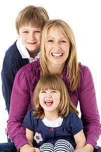 Mother With 2 Young Children In Studio