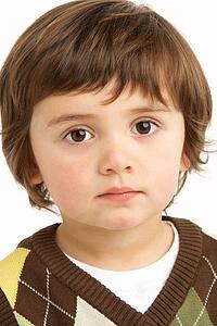 Studio Portrait Of Young Boy
