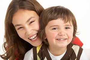 Studio Portrait Of Brother And Sister