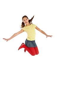 Mid Air Studio Shot Of Young Girl Jumping In Air