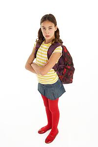 Studio Portrait Of Female Student With Backpack