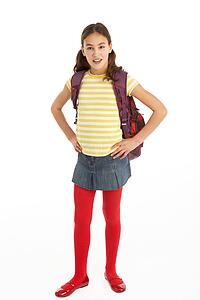 Studio Portrait Of Young Girl With Backpack
