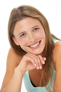 Studio Portrait Of Smiling Young Woman